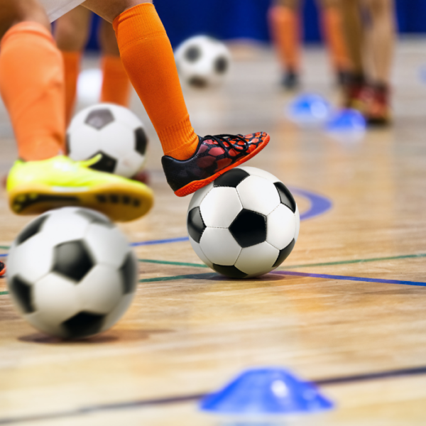 Children practising with footballs